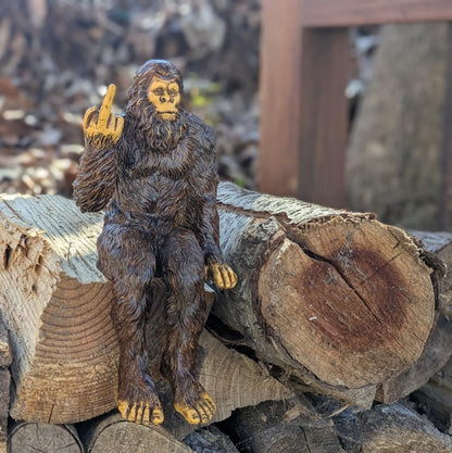 John Bernard & Company Bigfoot The Rude ‘Flipping The Bird’ Sasquatch Yeti Statue/Figurine Indoor/Outdoor Sculpture for Patio, Deck, Home, Office 10 in H Shelf Sitter Figurine (Natural)